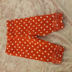 Red leggings with white poka dots